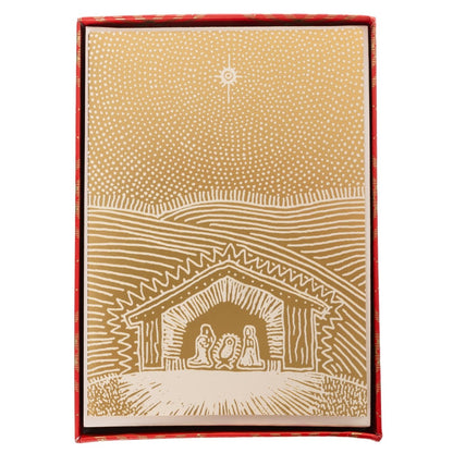 Gold Nativity Stable Holiday Cards, Box of 15, A box of cream Christmas cards printed with a gold foil nativity stable scene under a star.