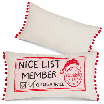 Nice List Member Lumbar Pillow, A cream lumbar pillow embroidered with Nice List Member, two green-checked boxes beside the words Checked Twice and a red Santa face, trimmed with red pom-poms on the short ends and shown with its plain cream back.