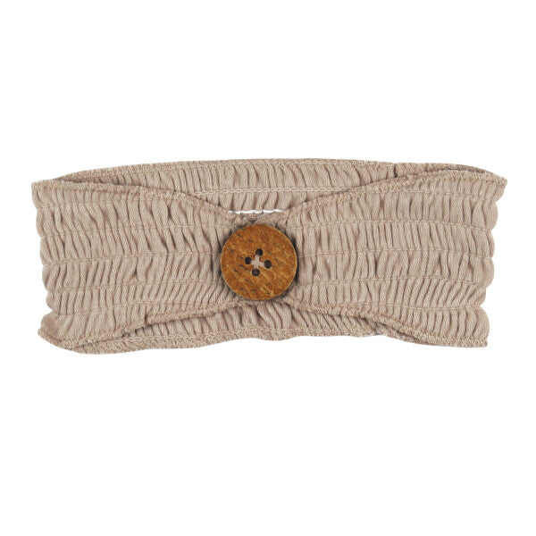 Organic Cotton Smocked Button Headband, Oatmeal, A stretchy, smocked oatmeal-colored fabric headband with a round wooden button at the center front.