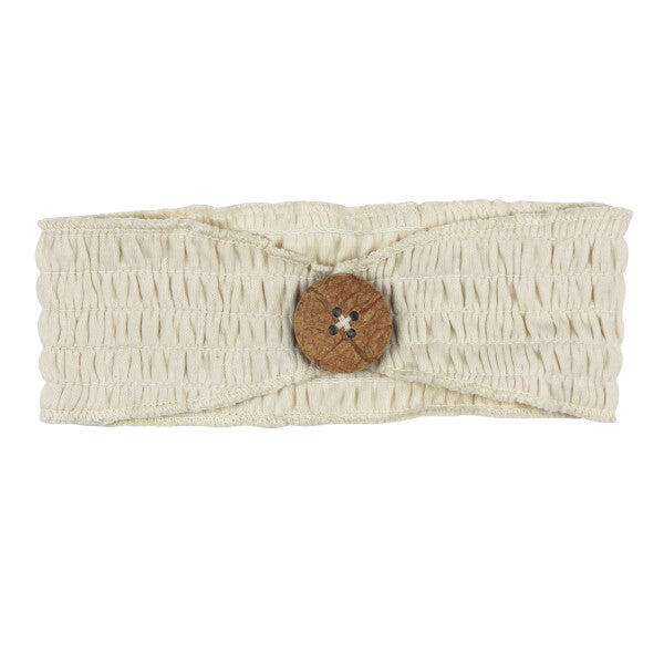 Organic Cotton Smocked Button Headband, Stone, A cream colored smocked fabric headband with a wooden button in the center, shown flat against a white background.