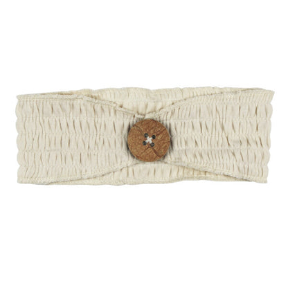 Organic Cotton Smocked Button Headband, Stone, A cream colored smocked fabric headband with a wooden button in the center, shown flat against a white background.