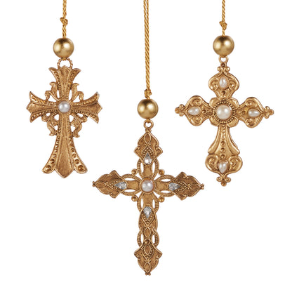 Ornate Gold Cross Ornament with Pearl, Three ornate gold metal cross ornaments on gold cords, each set with pearl-look stones, the center cross also set with clear teardrop stones.