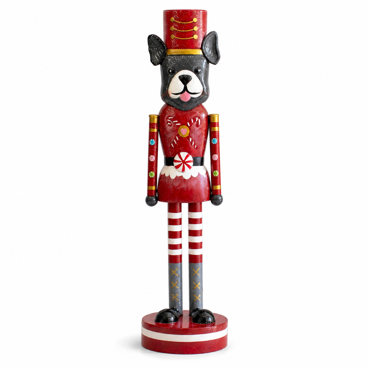 Painted Metal Dog Nutcracker, Black and White Dog design: a black dog with a white muzzle in a red coat painted with candy canes, a red hat, red and white striped legs, a red and white base