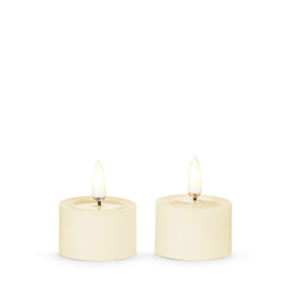 Pair of Ivory Melted Top Flameless Tealights, Two ivory flameless tealights with melted wax tops and lit flame-shaped tips, side by side on a white background.