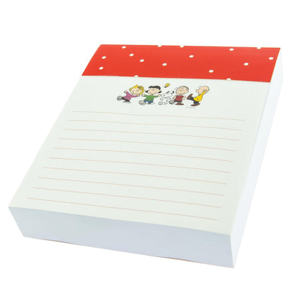 Peanuts Gang Jotter Notepad, A white jotter notepad with the Peanuts characters Charlie Brown, Snoopy, Linus, Lucy, Sally and Woodstock printed across the top of each sheet.