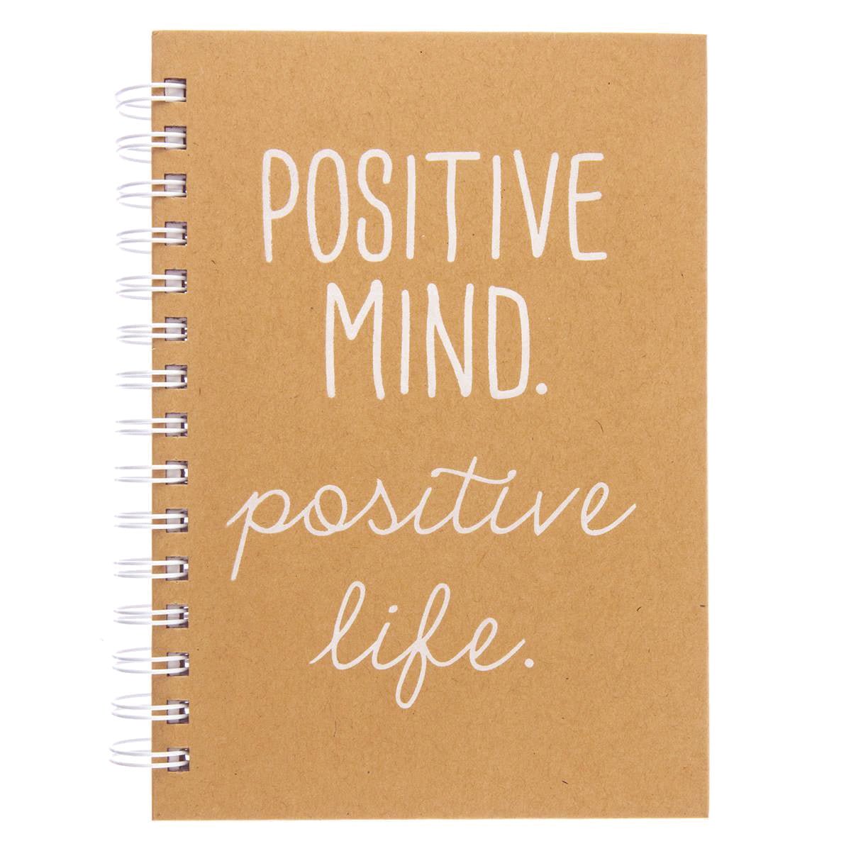 Positive Everyday Journal, A kraft brown spiral-bound journal with the words Positive Mind. Positive Life. printed in white foil script on the cover.