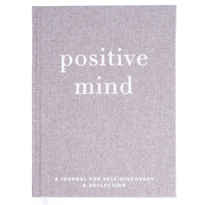 Positive Mind Self-Care Journal, A heathered gray fabric journal with 'positive mind' foiled in white above 'a journal for self-discovery and reflection'.