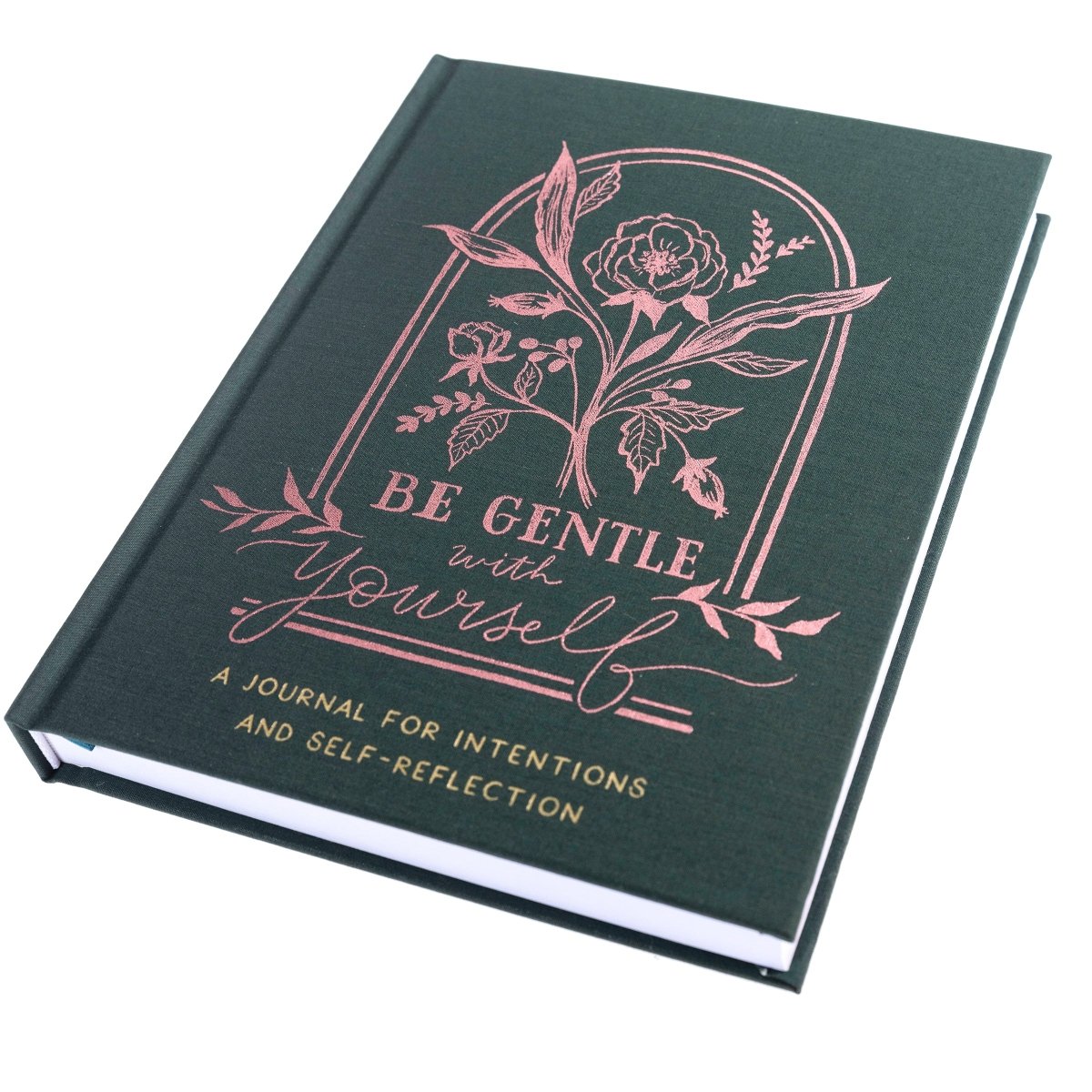 Positive Self-Care Journal, A deep green fabric journal with a rose gold botanical arch and 'Be Gentle With Yourself' foiled on the cover.