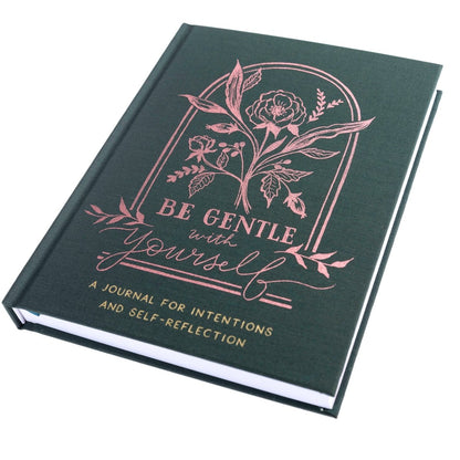 Positive Self-Care Journal, A deep green fabric journal with a rose gold botanical arch and 'Be Gentle With Yourself' foiled on the cover.