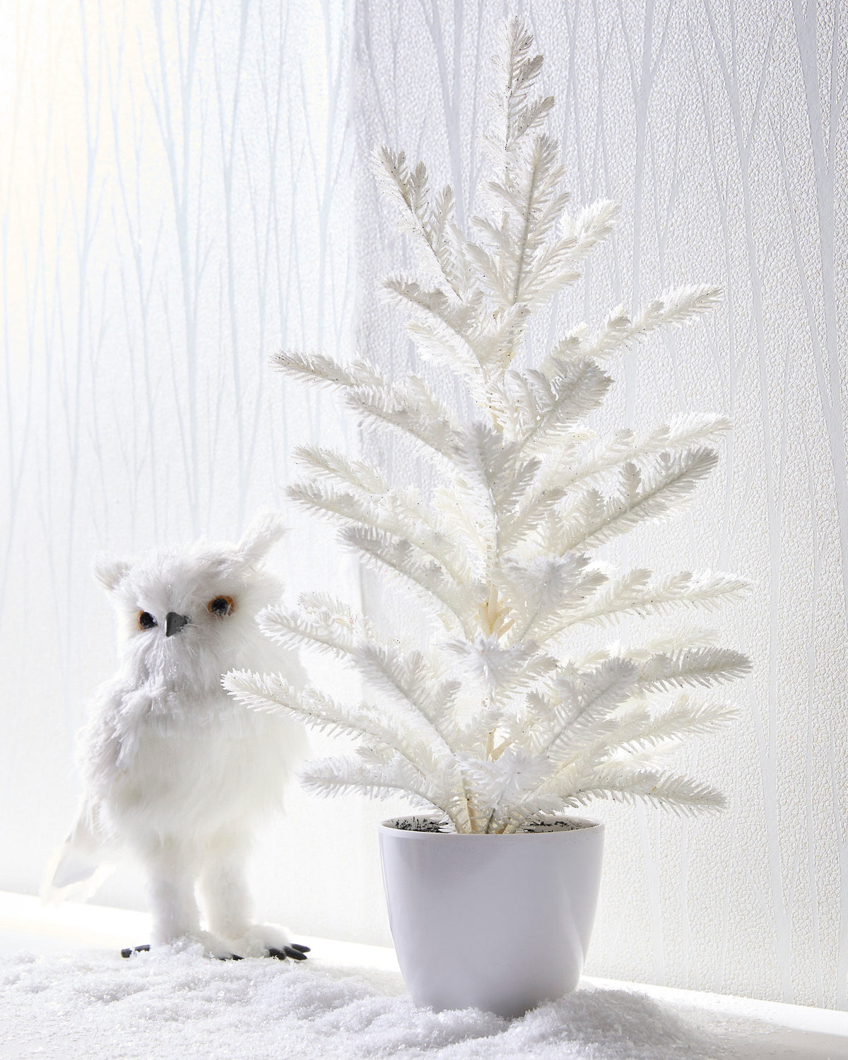 Potted White Glitter Tree, A slender white glitter Christmas tree set in a simple white pot.