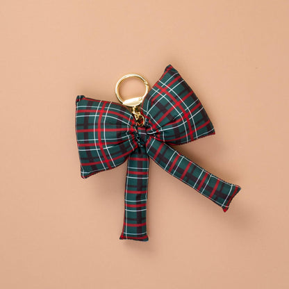 Puffy Bow Bag Charm, A green, red, and white plaid puffy bow shaped bag charm with a gold-toned keyring clasp.