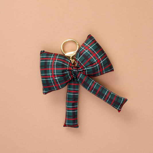 Puffy Bow Bag Charm, A green, red, and white plaid puffy bow shaped bag charm with a gold-toned keyring clasp.