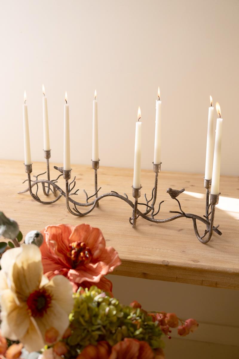 Rustic Metal Candelabra with Birds, A long curved iron candelabra with eight taper holders and two small bird figures.