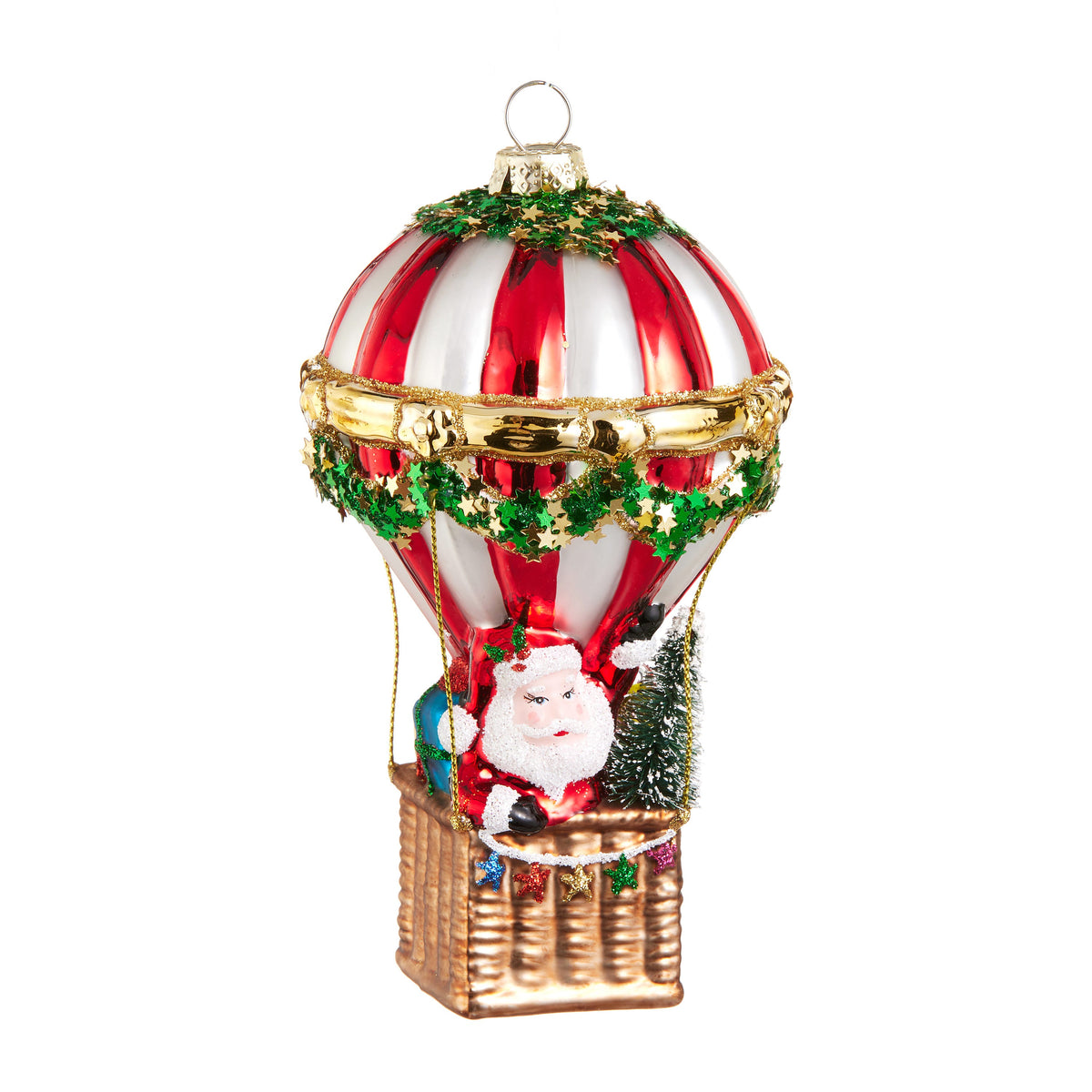 Santa Hot Air Balloon Ornament, A glass ornament showing Santa riding in the basket of a red and white striped hot air balloon with a small tree and gift bag.