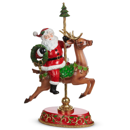 Santa on Carousel Deer Figurine, A resin figurine of Santa riding a carousel style reindeer on a gilded pole, set on an oval base with holly scrollwork.
