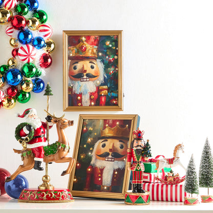 Santa on Carousel Deer Figurine, A resin figurine of Santa riding a carousel style reindeer on a gilded pole, set on an oval base with holly scrollwork.