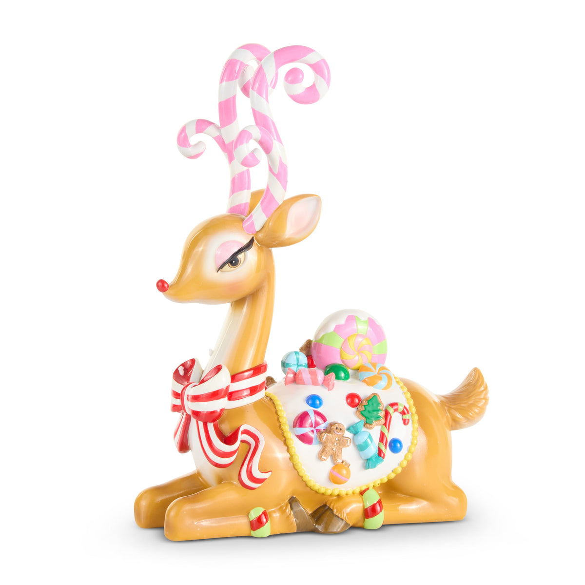 Sassy Jingle Sitting Deer Figure with Candy Cane Antlers, A brown resin deer resting with its legs folded, wearing pink and white candy cane antlers, a red and white striped bow and a saddle topped with a gingerbread man and candy.