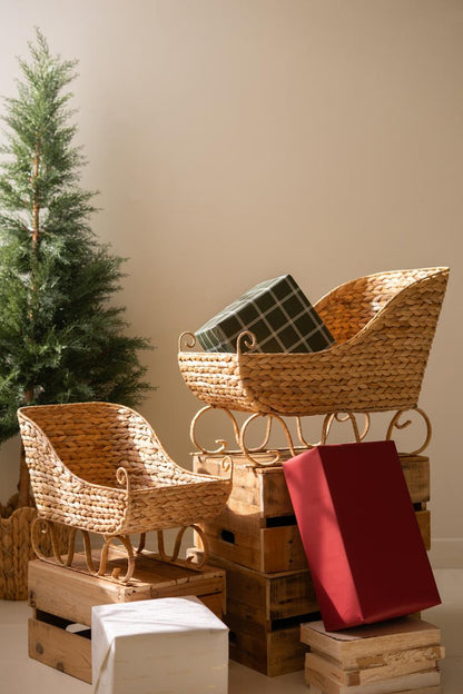 Seagrass Christmas Sleigh, Two woven sleigh shaped baskets, one large and one small, side by side.