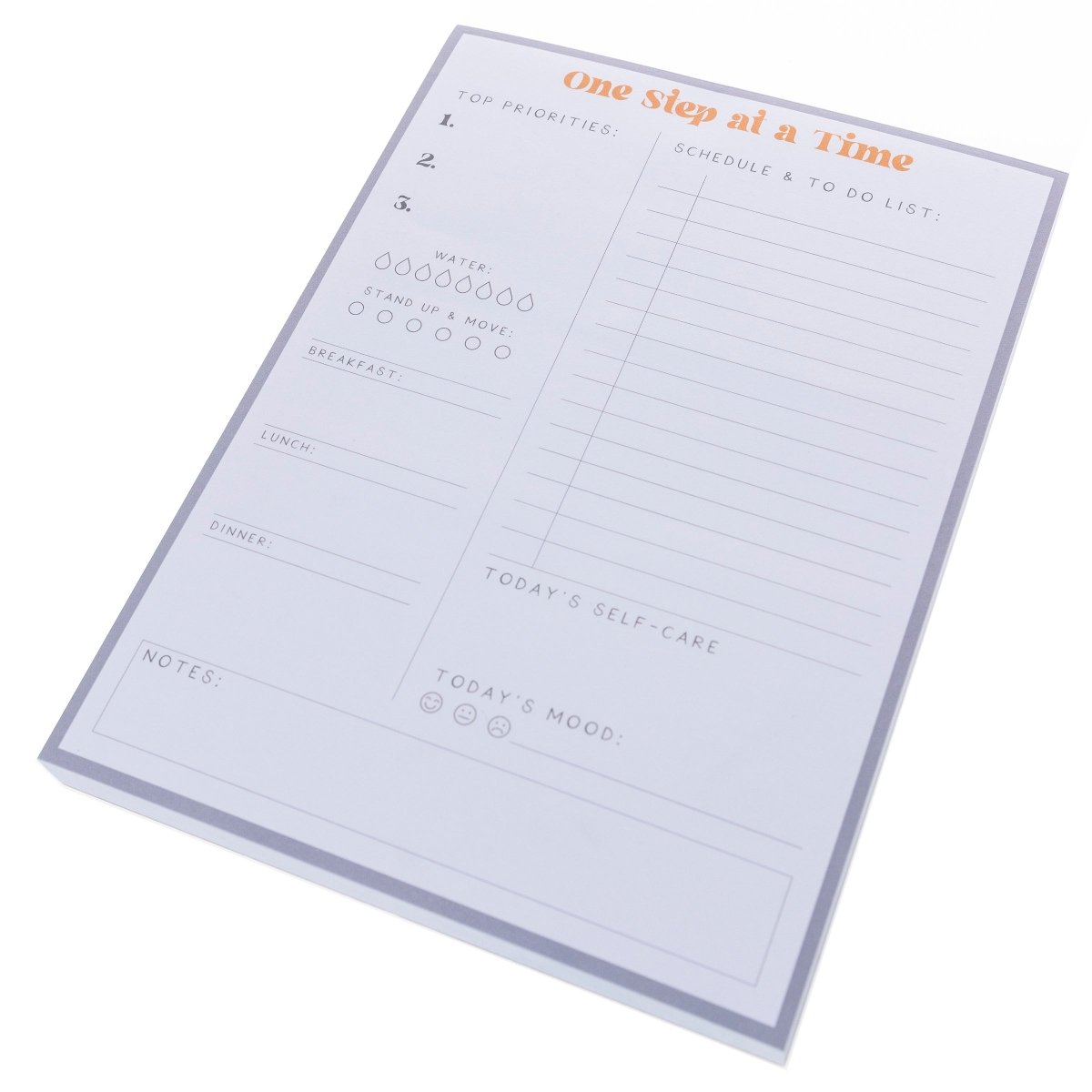 Self Care Large Notepad, A gray-bordered notepad printed 'One Step at a Time' in orange above sections for priorities, meals, water, movement, and self-care.