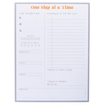 Self Care Large Notepad, A gray-bordered notepad printed 'One Step at a Time' in orange above sections for priorities, meals, water, movement, and self-care.