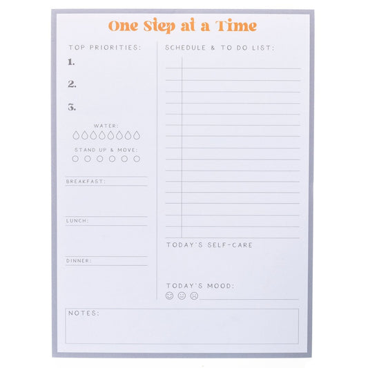 Self Care Large Notepad, A gray-bordered notepad printed 'One Step at a Time' in orange above sections for priorities, meals, water, movement, and self-care.