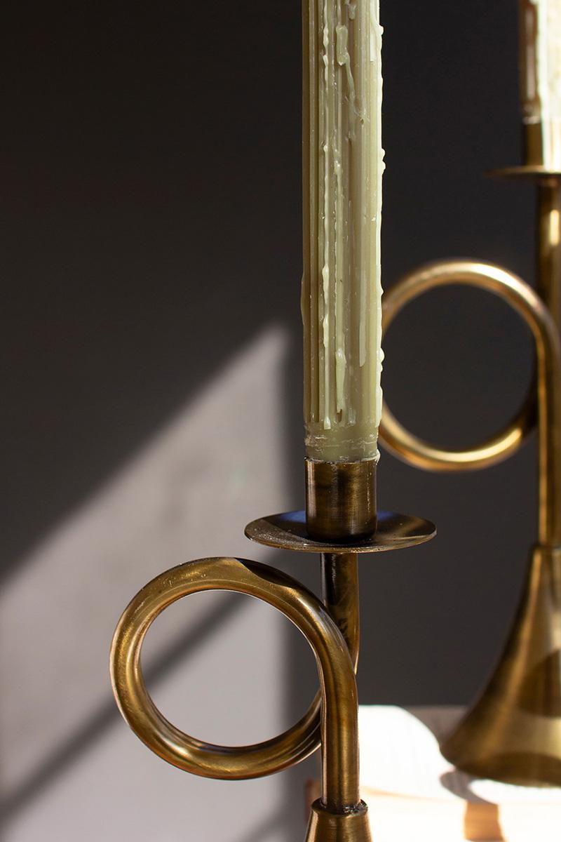 Antique Brass Trumpet Taper Candle Holder, Three antique brass taper candle holders shaped like trumpets in three heights.
