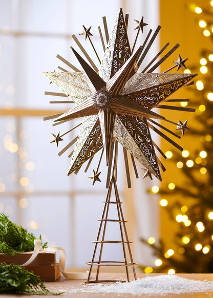 Starburst Tree Topper, An antique gold iron starburst tree topper with pierced scroll patterned points, smaller stars on wire spikes, and a pearl and rhinestone center medallion.