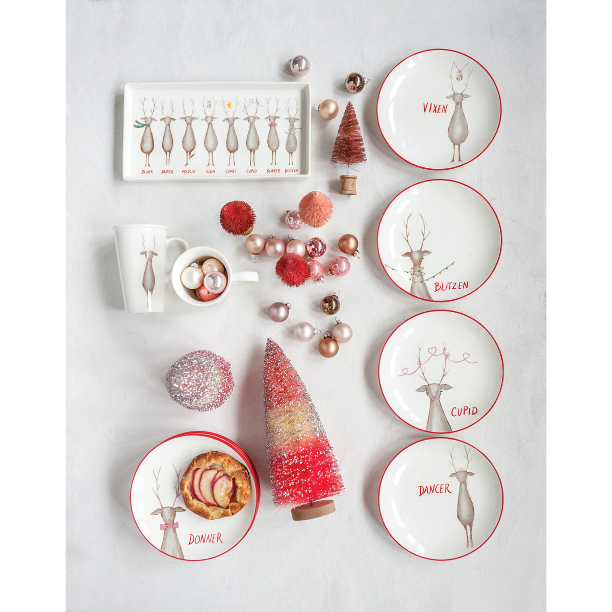 Stoneware Platter with Santa's Reindeer, A long white stoneware platter printed with eight reindeer in a row, each name lettered in red underneath, including Dasher, Dancer and Blitzen.
