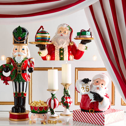 Table Top Santa Butler, A resin Santa figure holds two round gold trays in his outstretched hands.
