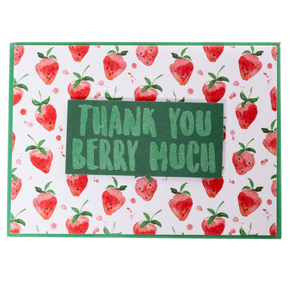 Thank You Berry Much Thank You Handmade Card, A white card patterned with watercolor strawberries and a green glitter tip-on banner reading Thank You Berry Much, shown with its envelope.