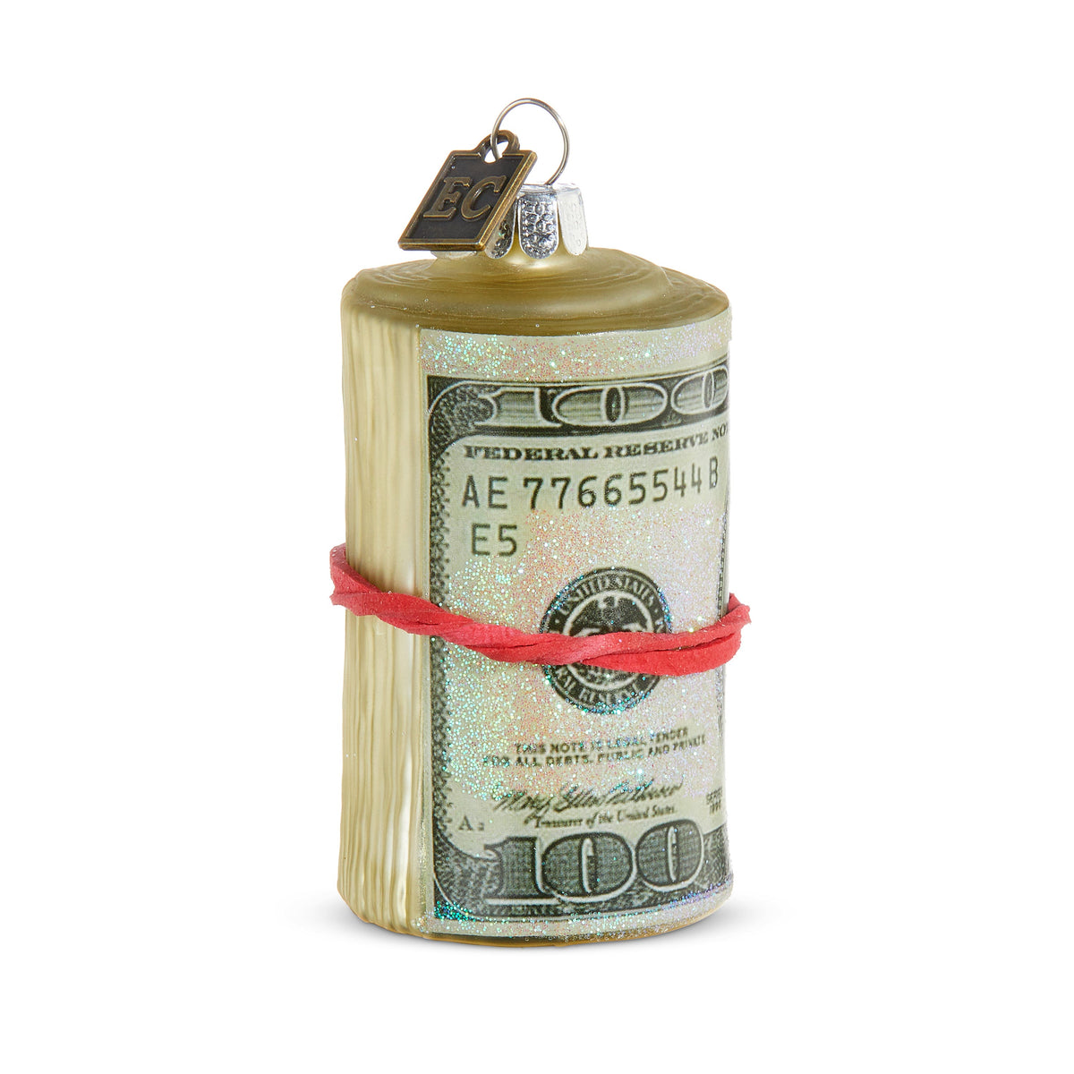 Thanks a Million Ornament, A glass Christmas ornament shaped like a rolled bundle of hundred-dollar bills tied with a red band, with a small EC tag at the top.