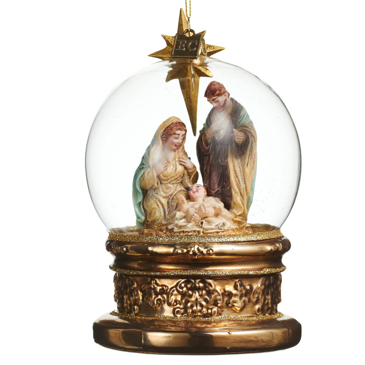 The Blessed Birth Globe Ornament, A clear glass globe ornament with a nativity scene of Mary, Joseph and the baby, set on a gold toned base.