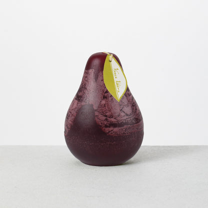 Timber Pear Candle 3 x 4 Inch, A green pear shaped candle with a textured surface stands tied with a small leaf shaped hang tag.