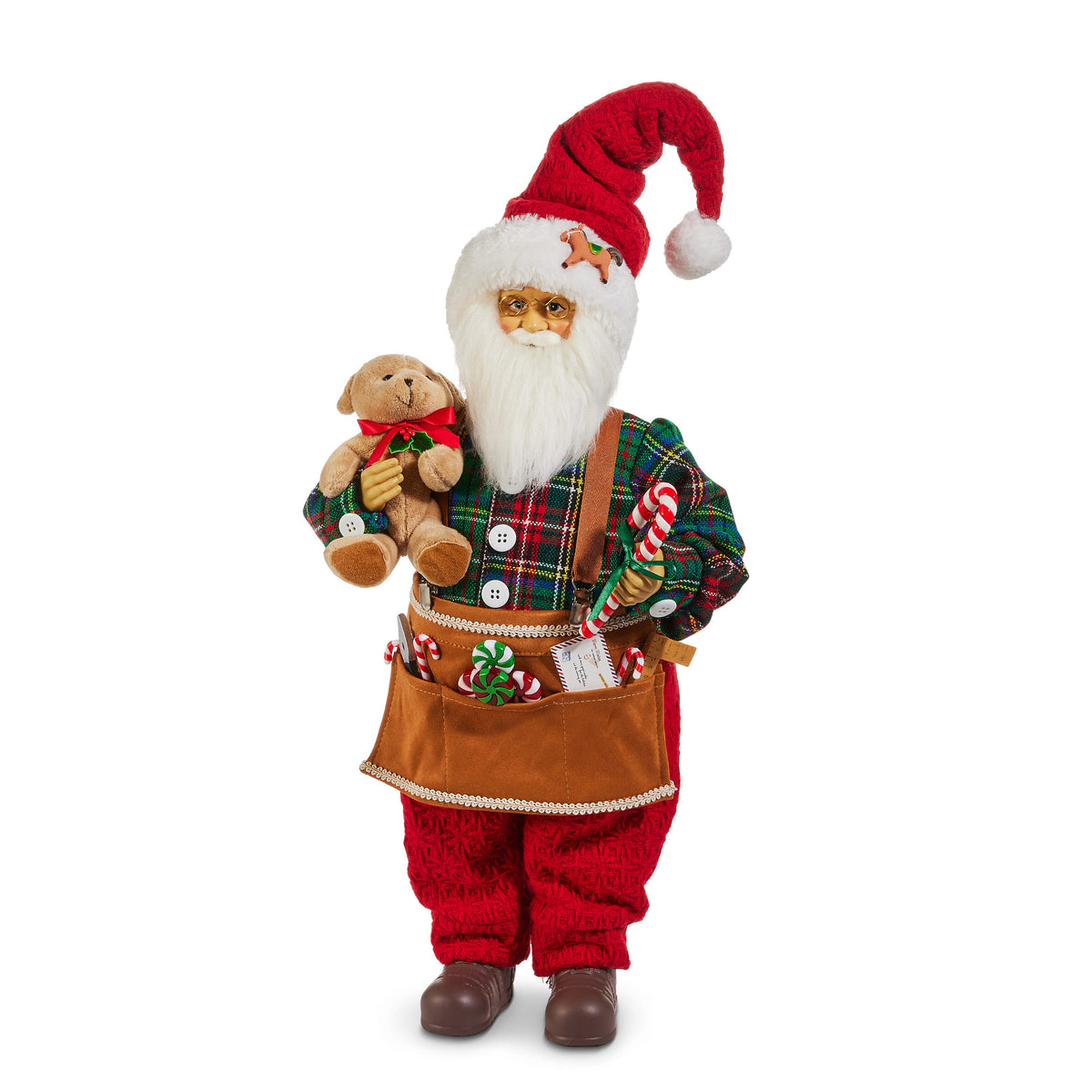 Toy Shop Santa Figure with Teddy Bear, A standing Santa figure with round glasses, a red knit hat, a tartan plaid shirt with suspenders and a tan tool apron holding candy canes and peppermints, carrying a teddy bear and a candy cane.
