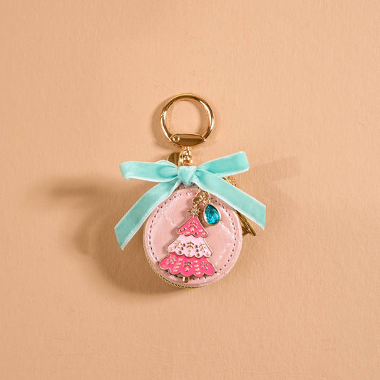 Travel Jewelry Case Bag Charm, A tan round zip case charm with a green gingham bow, a pearl, a gold bee, and a honeycomb charm, in the Hey Honey design.