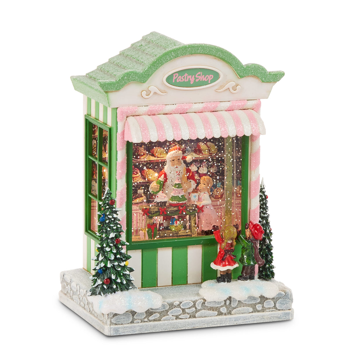 Treat Time Bakery Lighted Water Lantern, Green and white striped pastry shop water lantern with a pink candy-stripe awning, Santa decorating a tree cake inside and two children at the window.