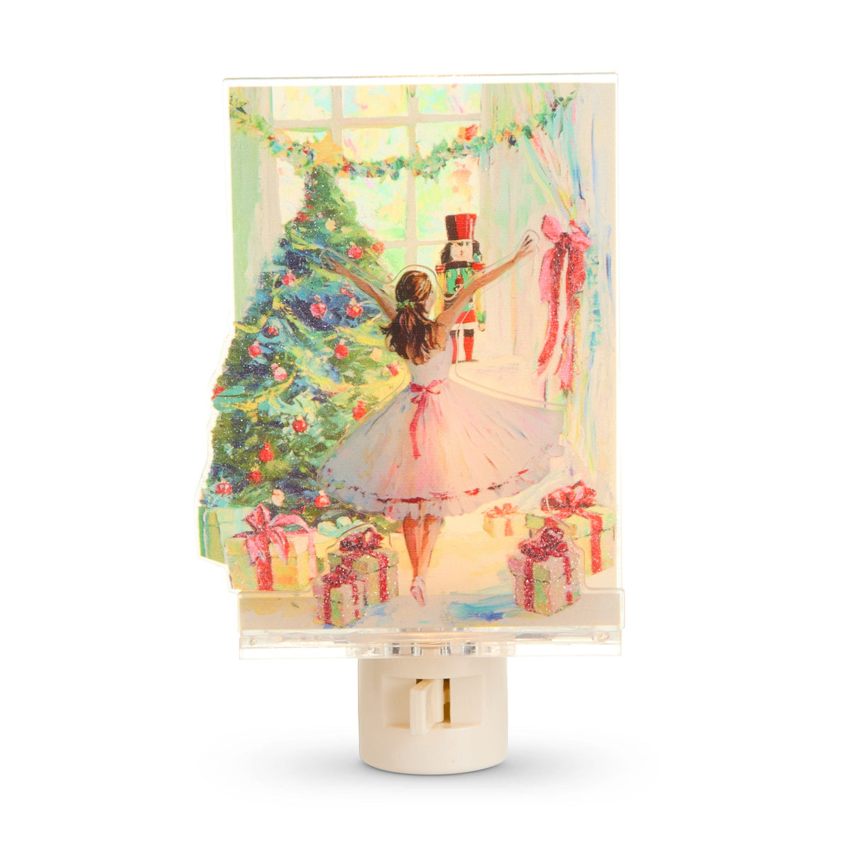 Twirl of the Season Ballerina Night Light, A layered night light showing a ballerina in a pink tutu raising her arms toward a window with a toy nutcracker, beside a decorated tree and wrapped presents.