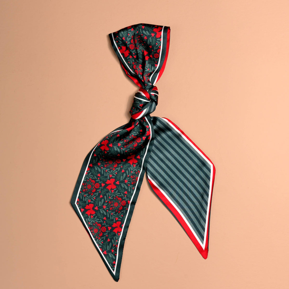 Twirl & Tie Scarf Accessory, A red and white gingham satin scarf tied in a knot, showing a red polka dot pattern on the reverse side of the tails.