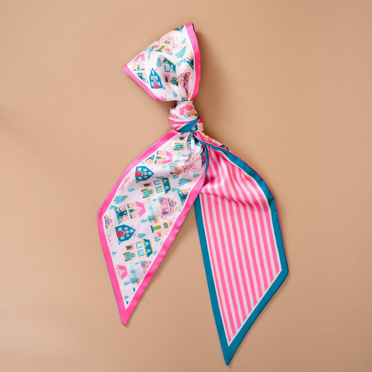 Twirl & Tie Scarf Accessory, A red and white gingham satin scarf tied in a knot, showing a red polka dot pattern on the reverse side of the tails.