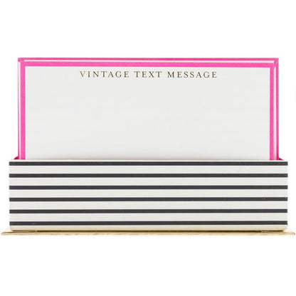 Vintage Text Flat Notes, A hot pink bordered flat note card printed Vintage Text Message in gold foil, standing in a black and white striped box.