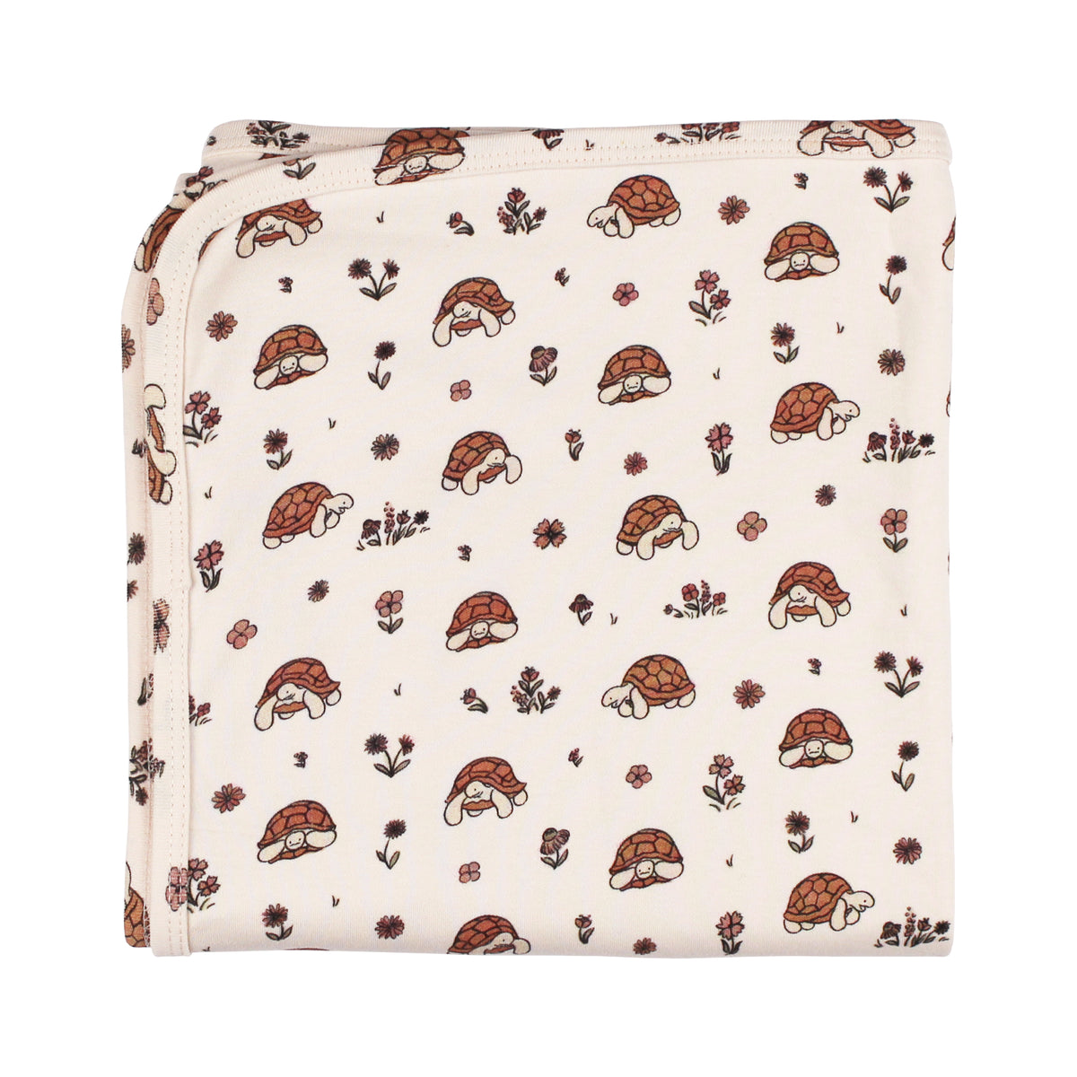 Organic Cotton Baby Blanket, Tiny Tortoise Print, A cream baby blanket folded to show a repeating print of tortoises with floral accents.