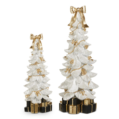 White Bow-Topped Christmas Tree with Presents, White resin Christmas trees in a small and a large size, each topped with a gold bow, trimmed with gold bells, bows and bead garland, and standing on a base of black and gold wrapped presents.
